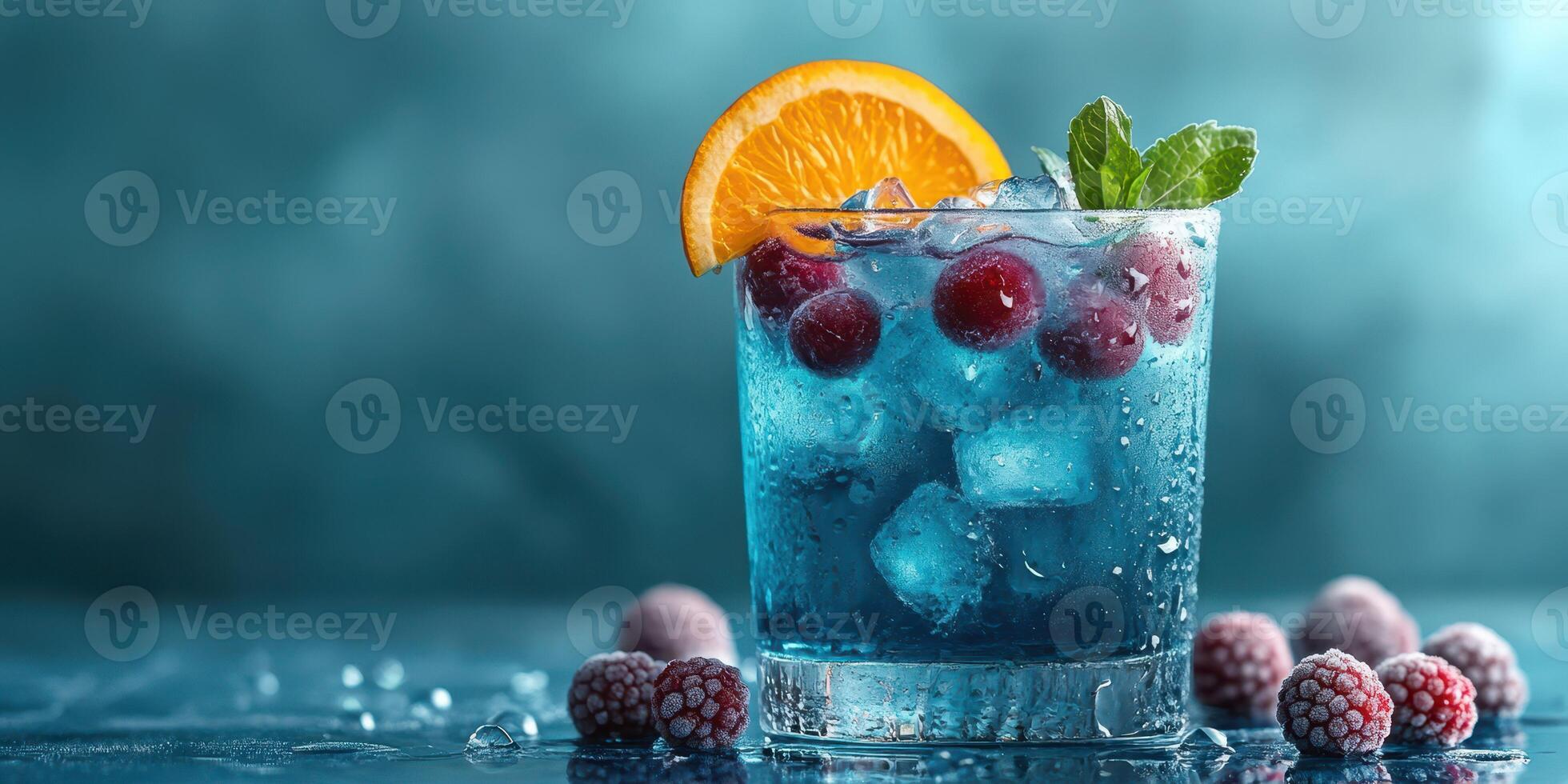 Refreshing blue cocktail garnished with orange slice and mint on a cool surface photo
