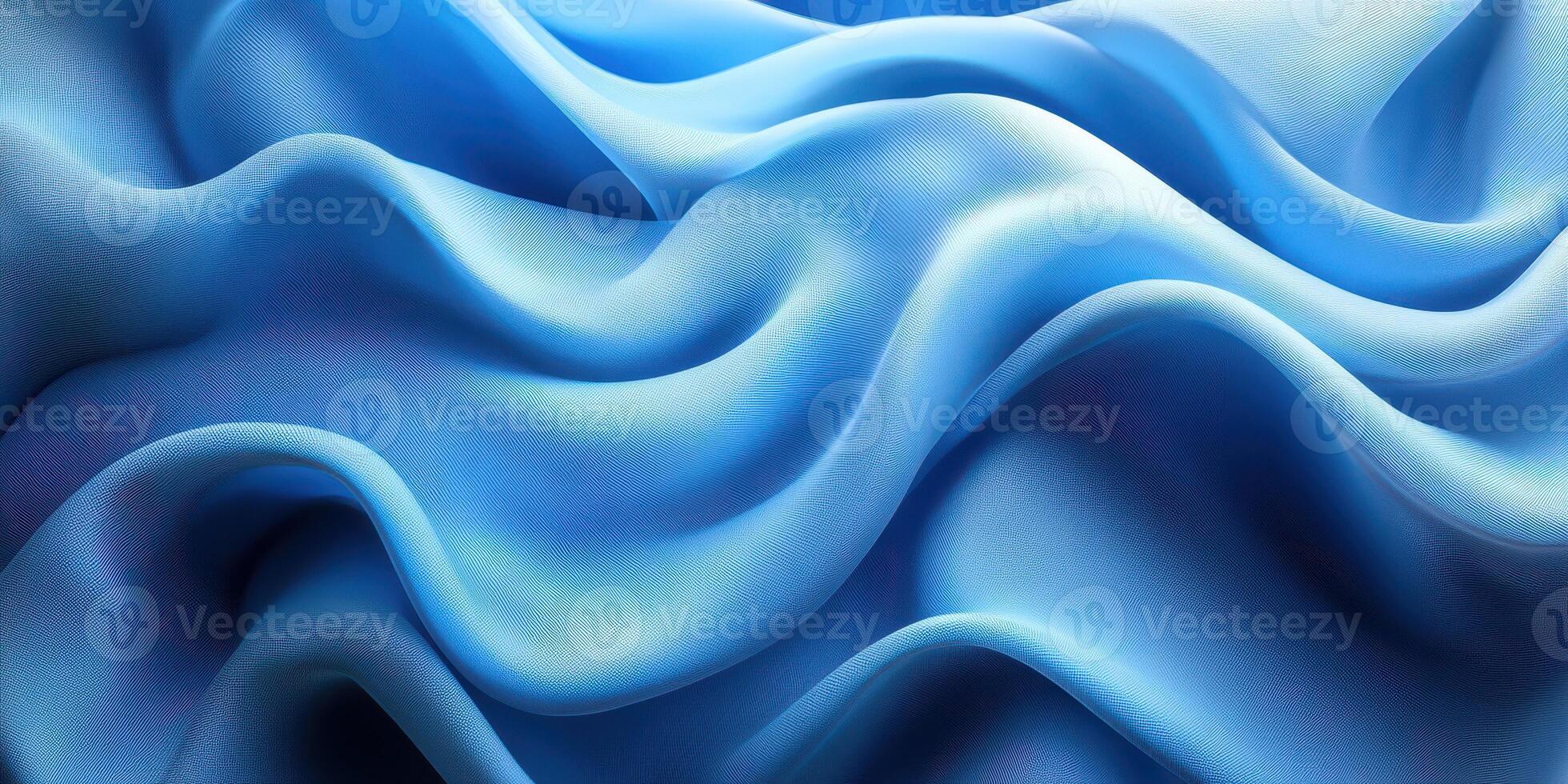 Soft blue fabric creates gentle waves and texture under natural light showcasing elegant draping and smoothness photo