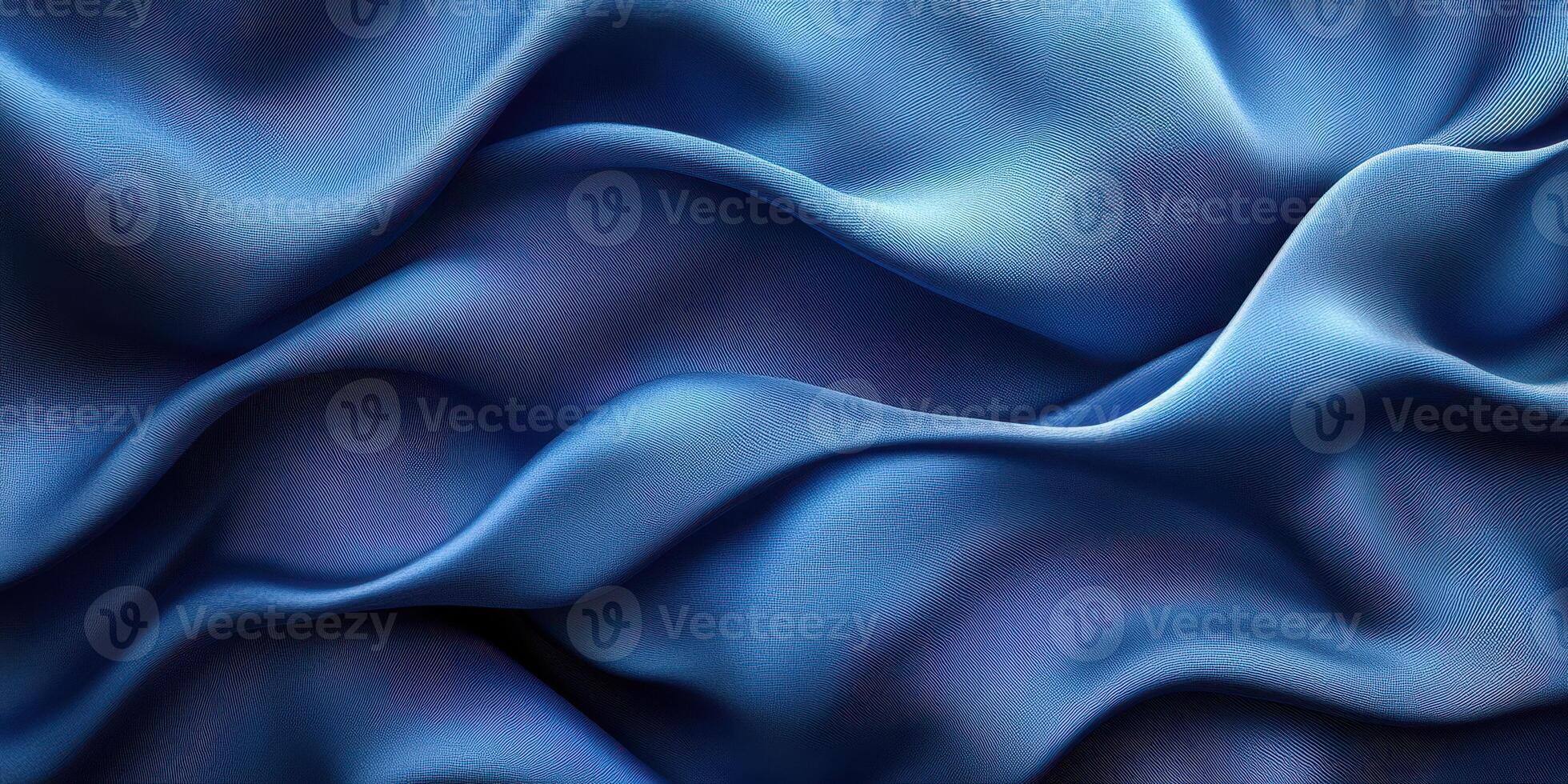 Soft blue fabric drapes gracefully, showcasing intricate texture and depth in gentle waves of color and light photo