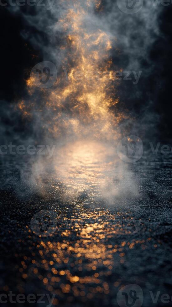 Warm light dances through fog on a dark and wet surface in the early hours of the morning photo