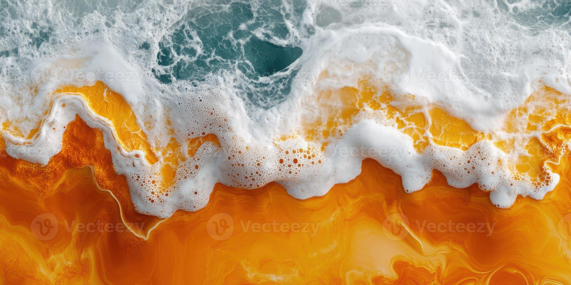 Ocean waves crashing on vibrant orange sandy beach during sunset with white foam splashing photo