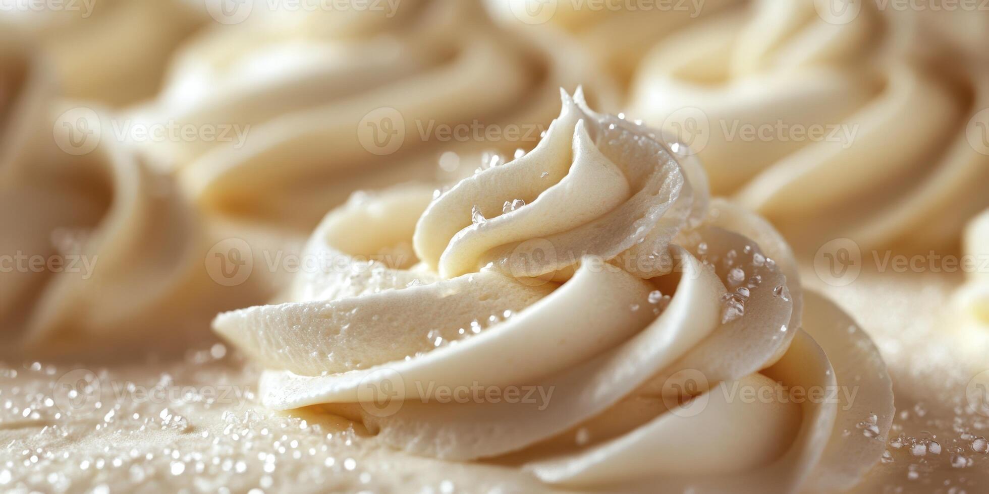 Creamy white frosting swirls on dessert topped with sparkling sugar on a light background photo