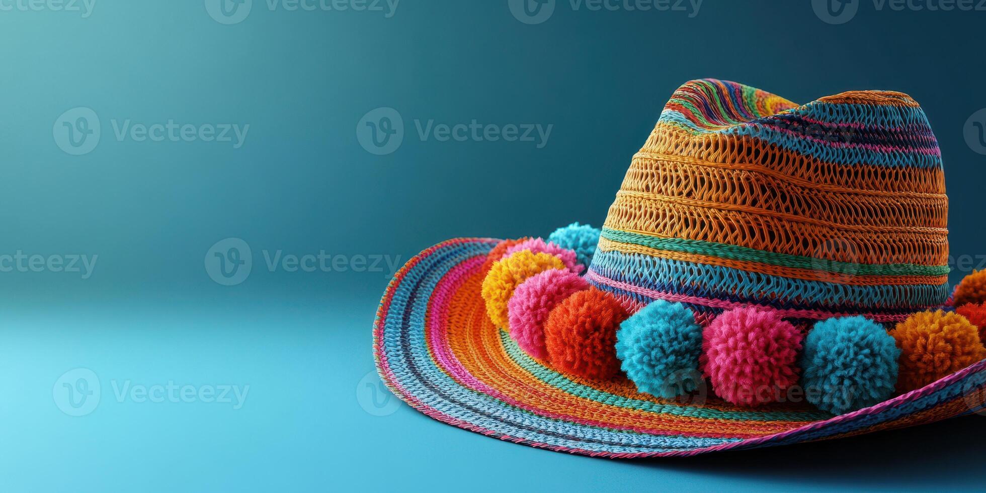 Colorful woven hat with pom-poms showcased against a vibrant blue background in a brightly lit setting photo