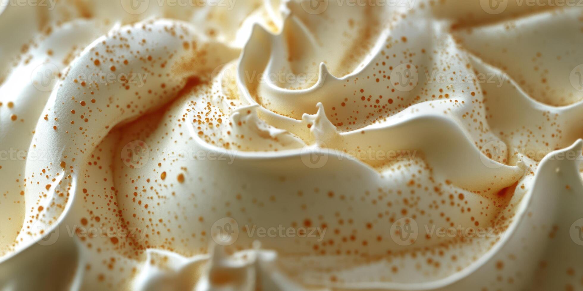 Creamy dessert topping with intricate swirls and golden flecks during an afternoon gathering photo
