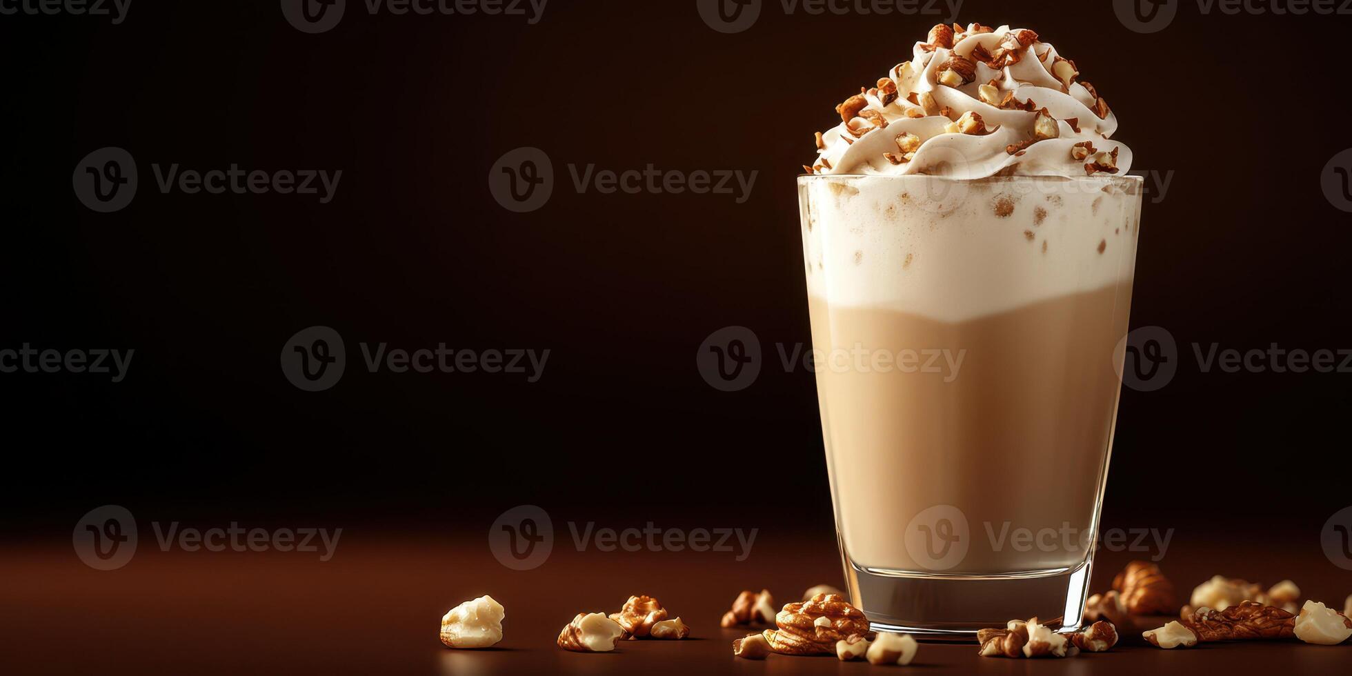 Creamy caramel coffee beverage topped with whipped cream and popcorn pieces in a cozy setting photo