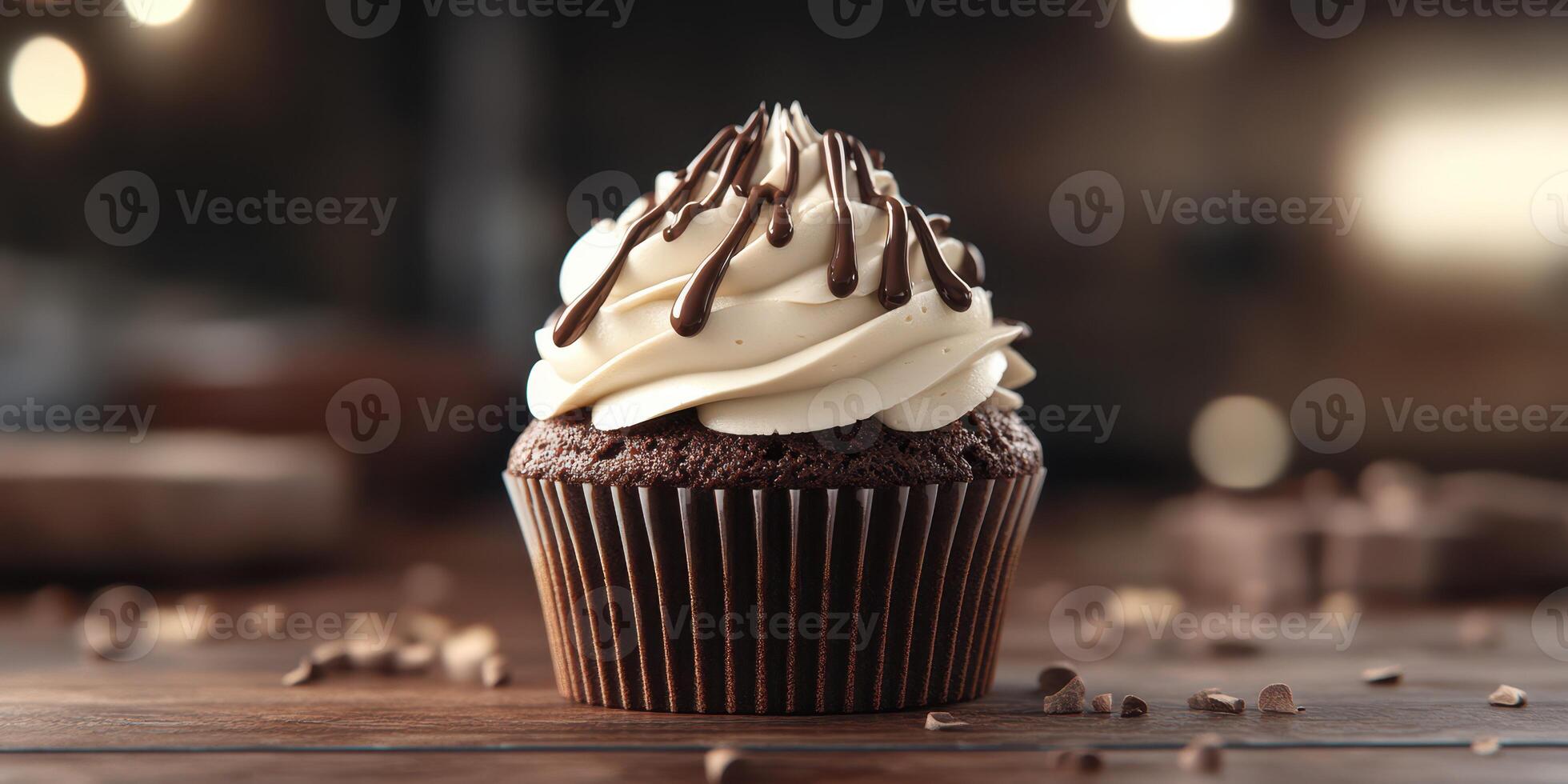 Chocolate cupcake with swirls of cream and chocolate drizzle on wooden table in cozy bakery photo