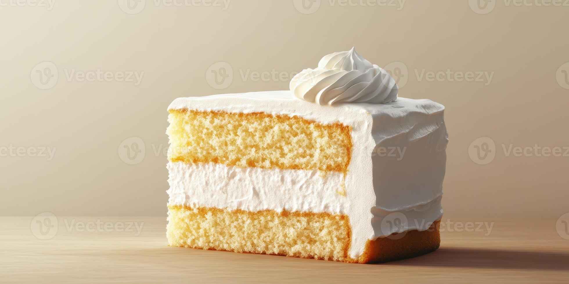 Moist vanilla cake slice topped with fluffy whipped cream on a wooden table photo