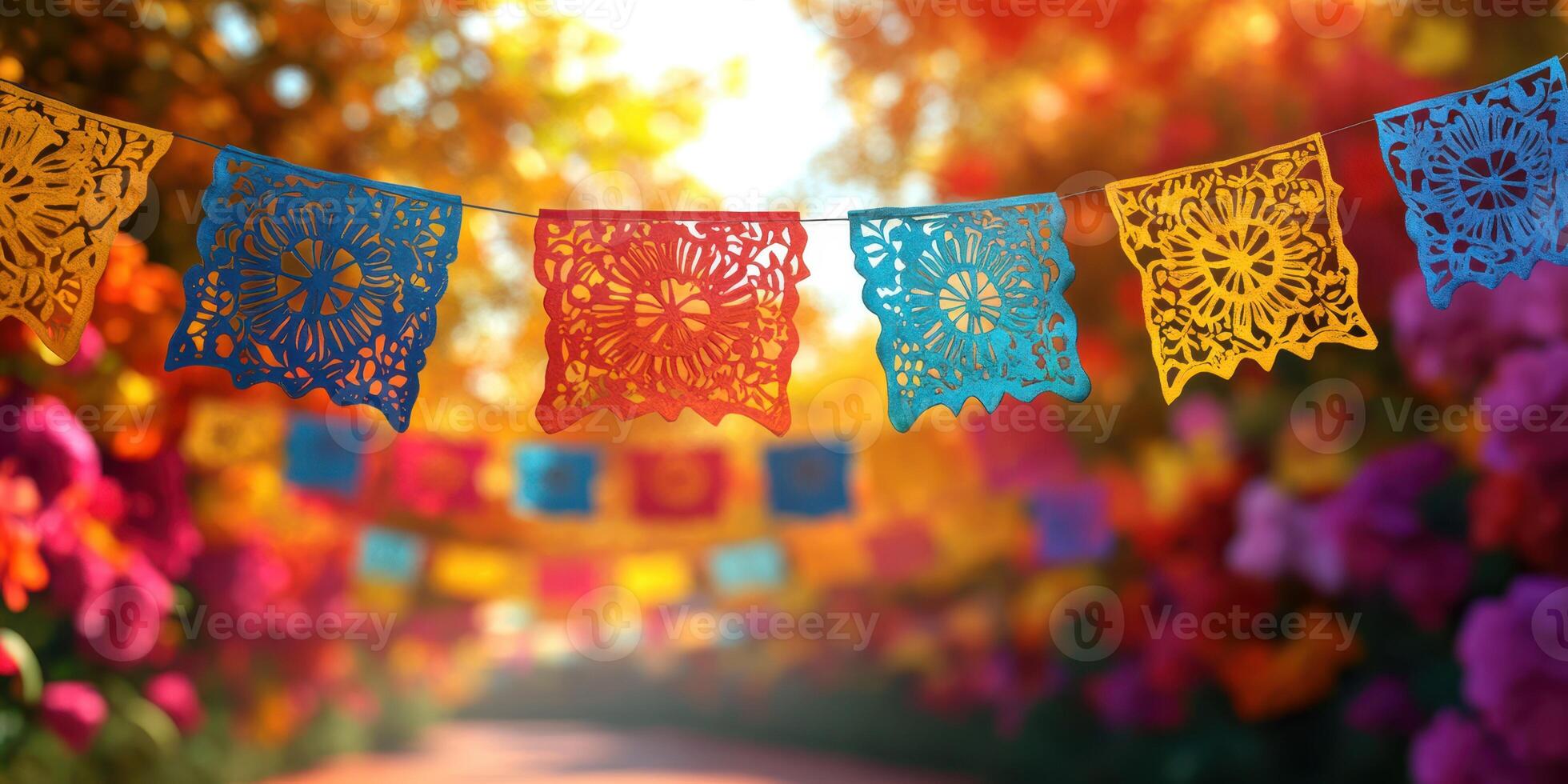 Colorful papel picado decorations illuminate a vibrant garden pathway during a festive celebration in autumn photo