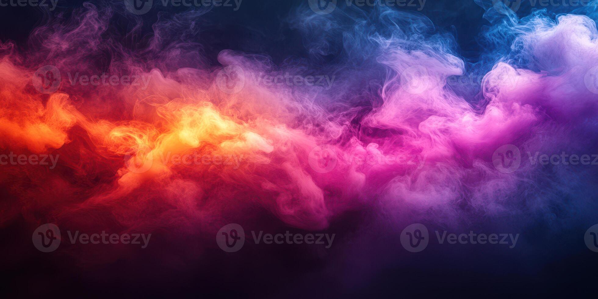 Colorful smoke swirling in gradients of orange, pink, and blue against a dark background creates a mesmerizing visual effect photo