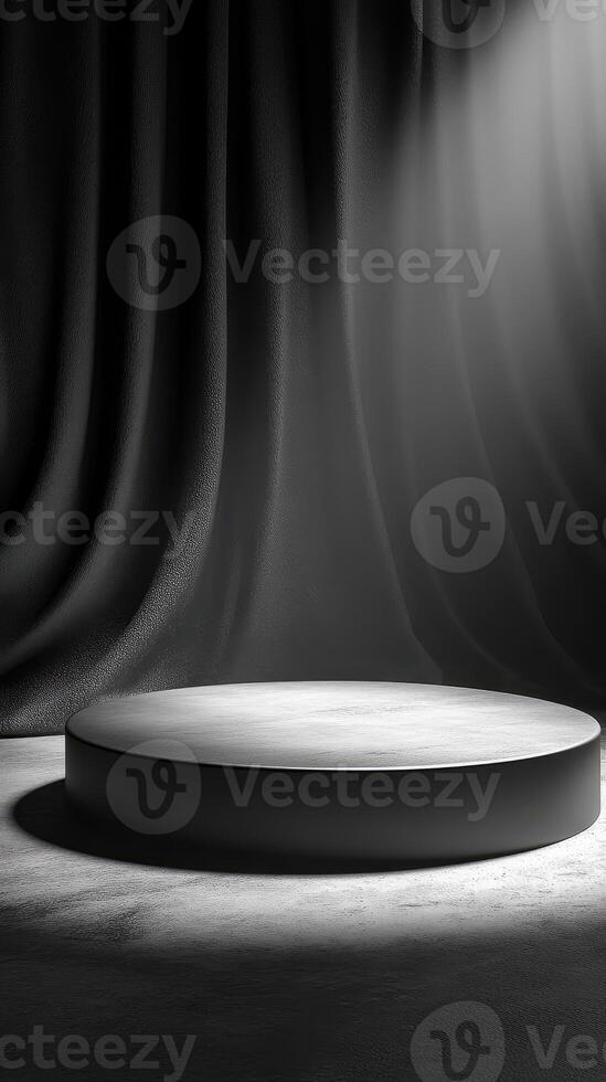 Circular platform illuminated by soft light with dark curtains in a minimalist setting during an artistic event photo
