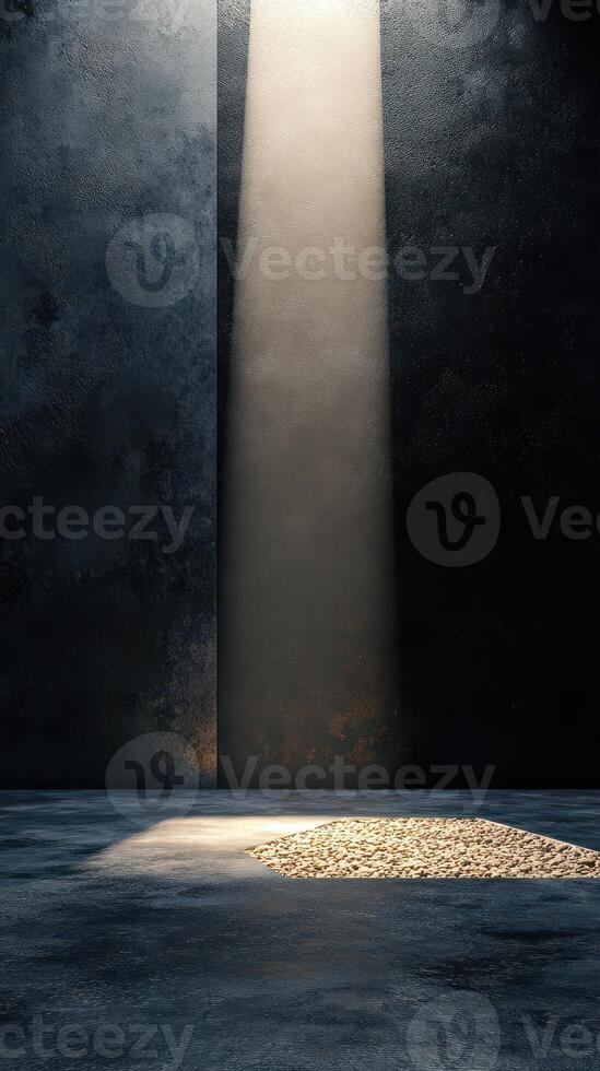 Shimmering light beams illuminate a textured surface revealing scattered pebbles in a dark setting photo