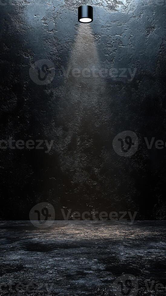 Dramatic lighting illuminates an empty stage with a textured black background in a minimalistic setting photo