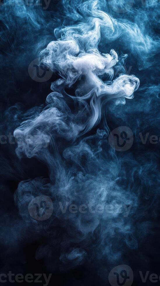 Swirling blue smoke fills the dark backdrop creating a mystical atmosphere during an artistic performance photo