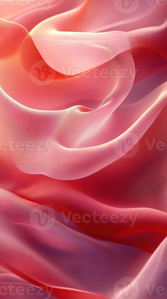 Soft pink and coral fabric drapes creating elegant folds and textures in natural light photo