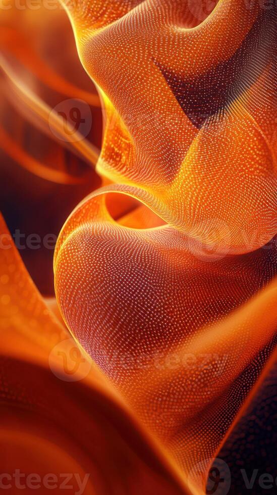 Flowing orange textures create a mesmerizing visual in a natural setting during soft lighting conditions photo