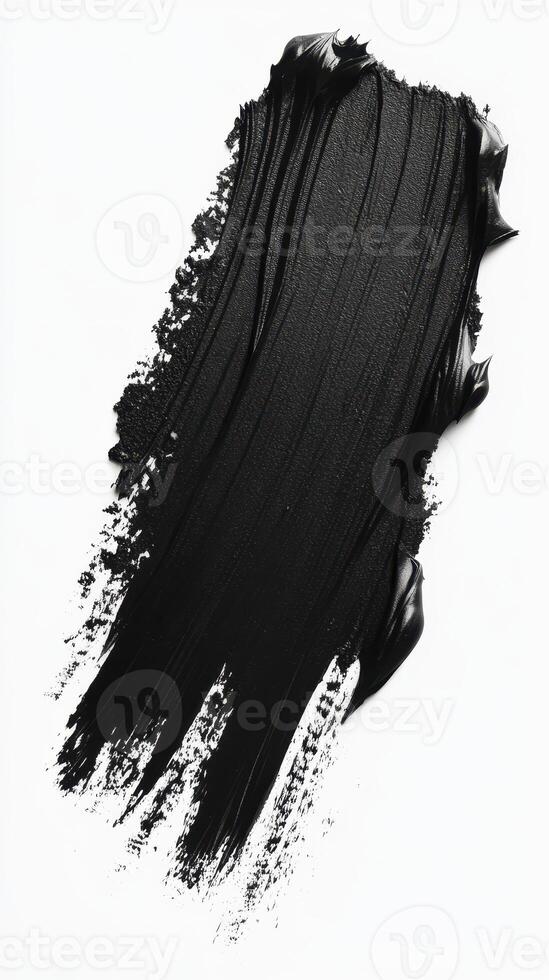 Smooth black paint texture applied in sweeping strokes on a white background for artistic design photo
