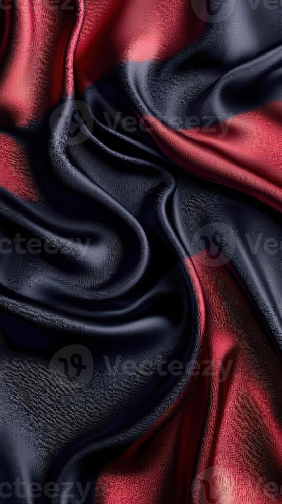 Silk fabric draped in deep red and black colors showcasing elegant texture and sheen in soft lighting photo