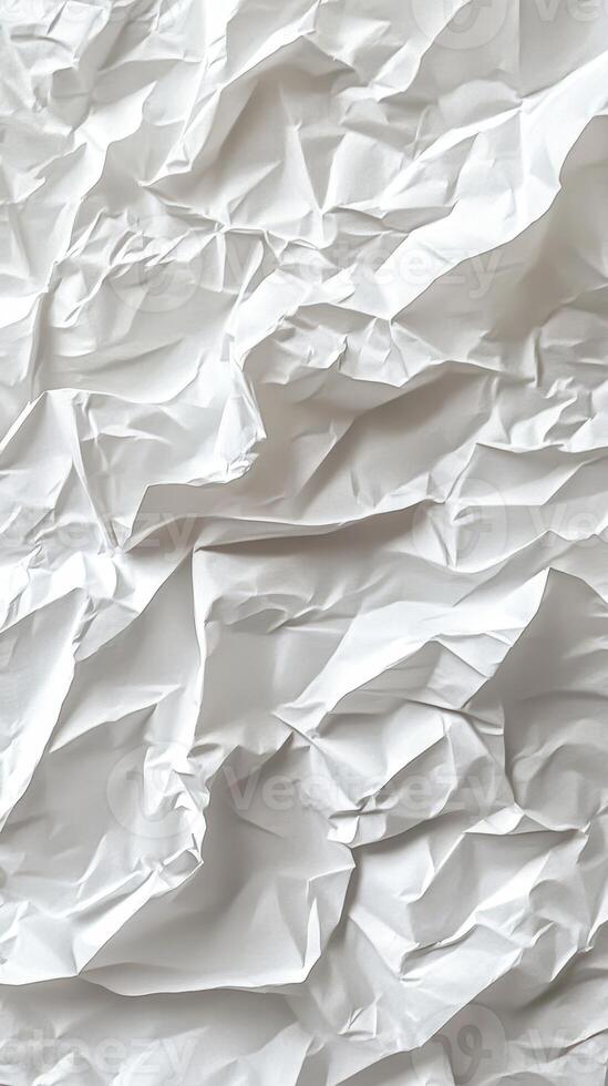 Crumpled white paper texture with various folds and wrinkles in natural light photo
