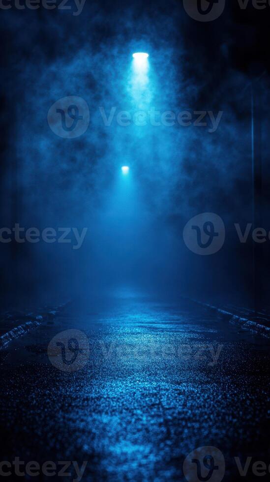 Mysterious foggy alley illuminated by blue lights in the evening photo