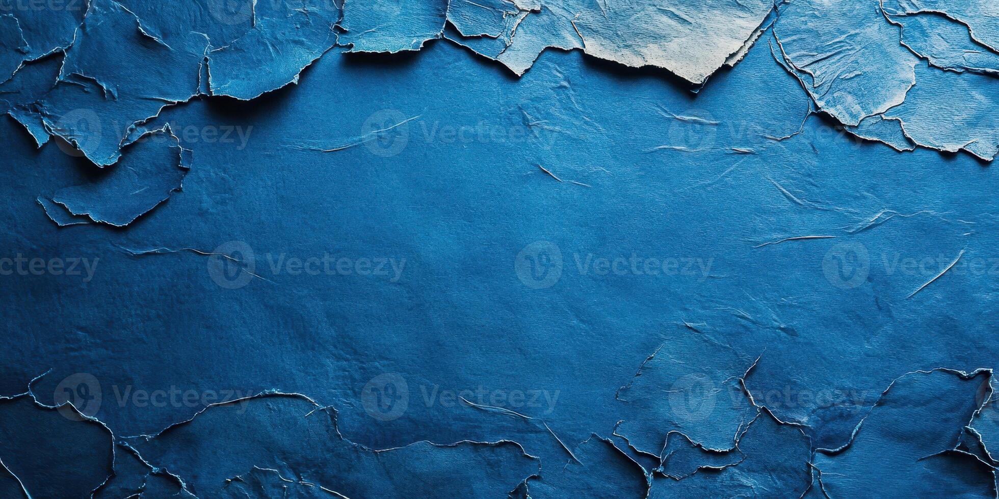 Textured blue background showcasing cracked and peeling layers of material, creating a distinctive visual interest ideal for artistic projects photo