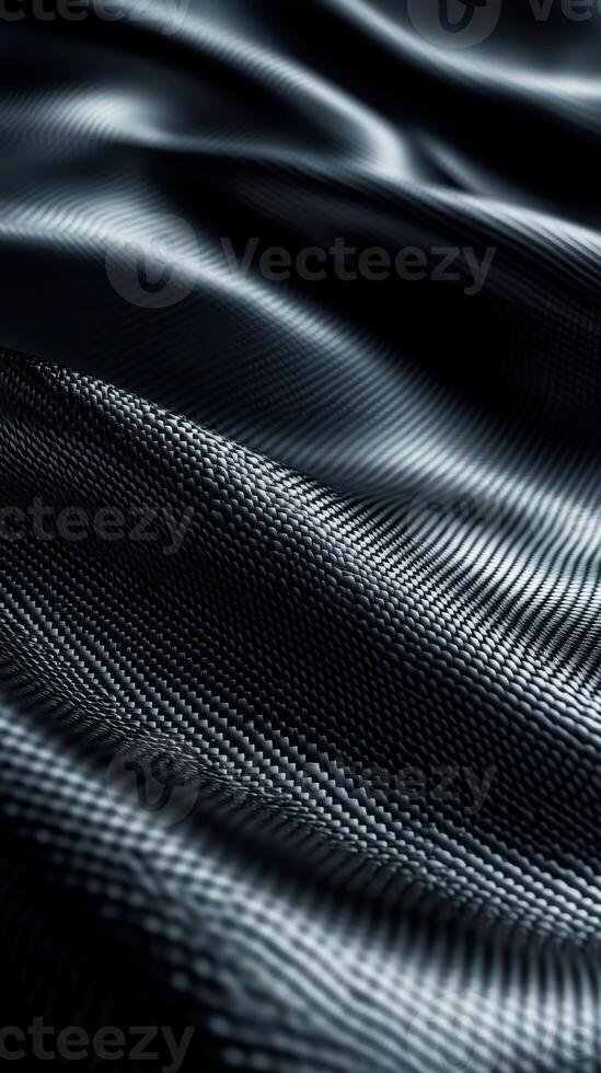 Close-up view of luxurious dark fabric showcasing intricate texture and smooth waves photo
