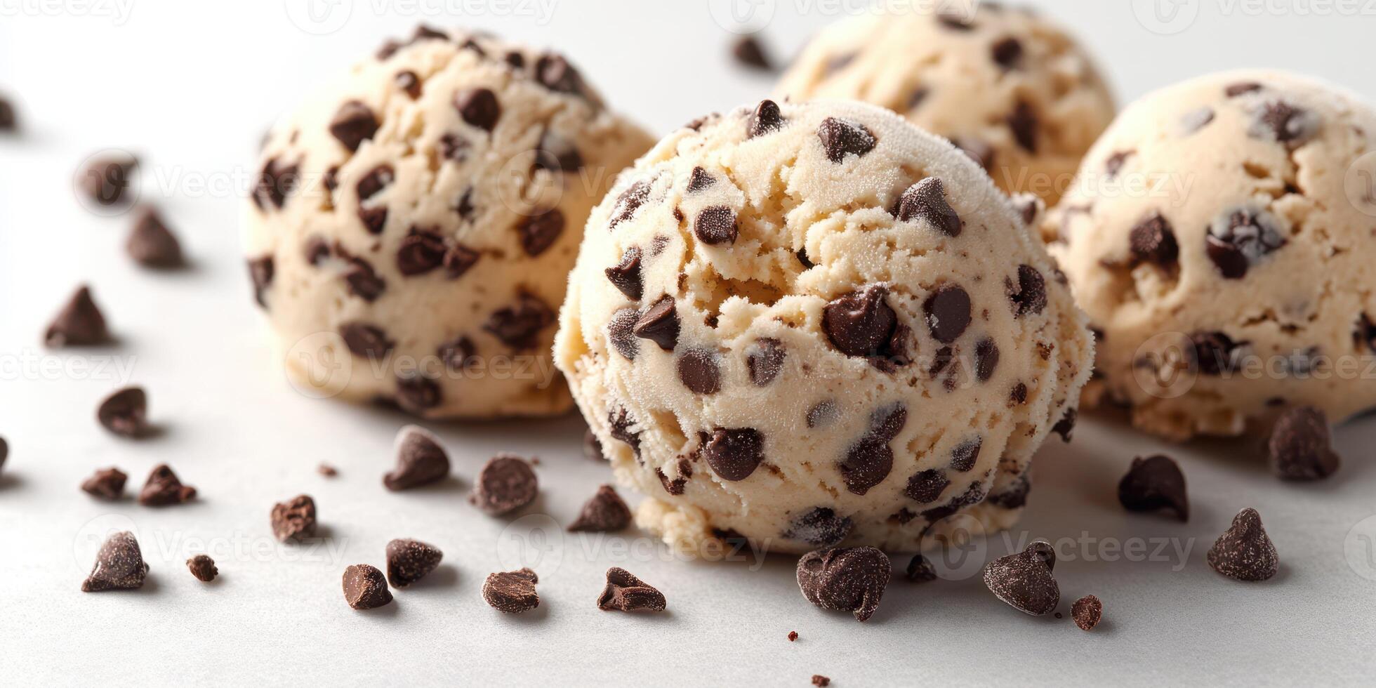 Tasty chocolate chip ice cream scoops on a light background attracting attention during a warm afternoon photo