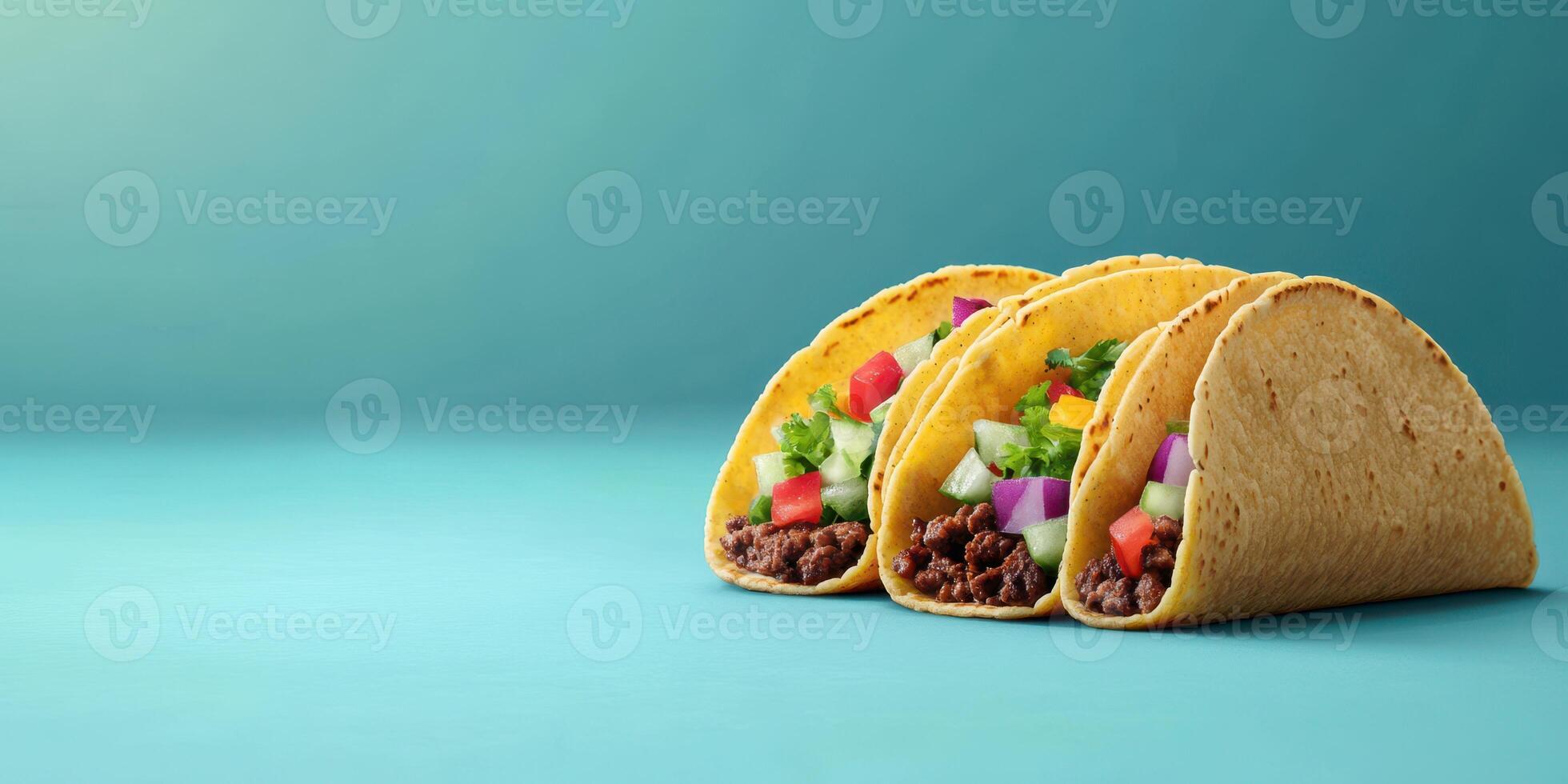 Delicious and colorful tacos filled with seasoned meat and fresh vegetables on a vibrant background photo