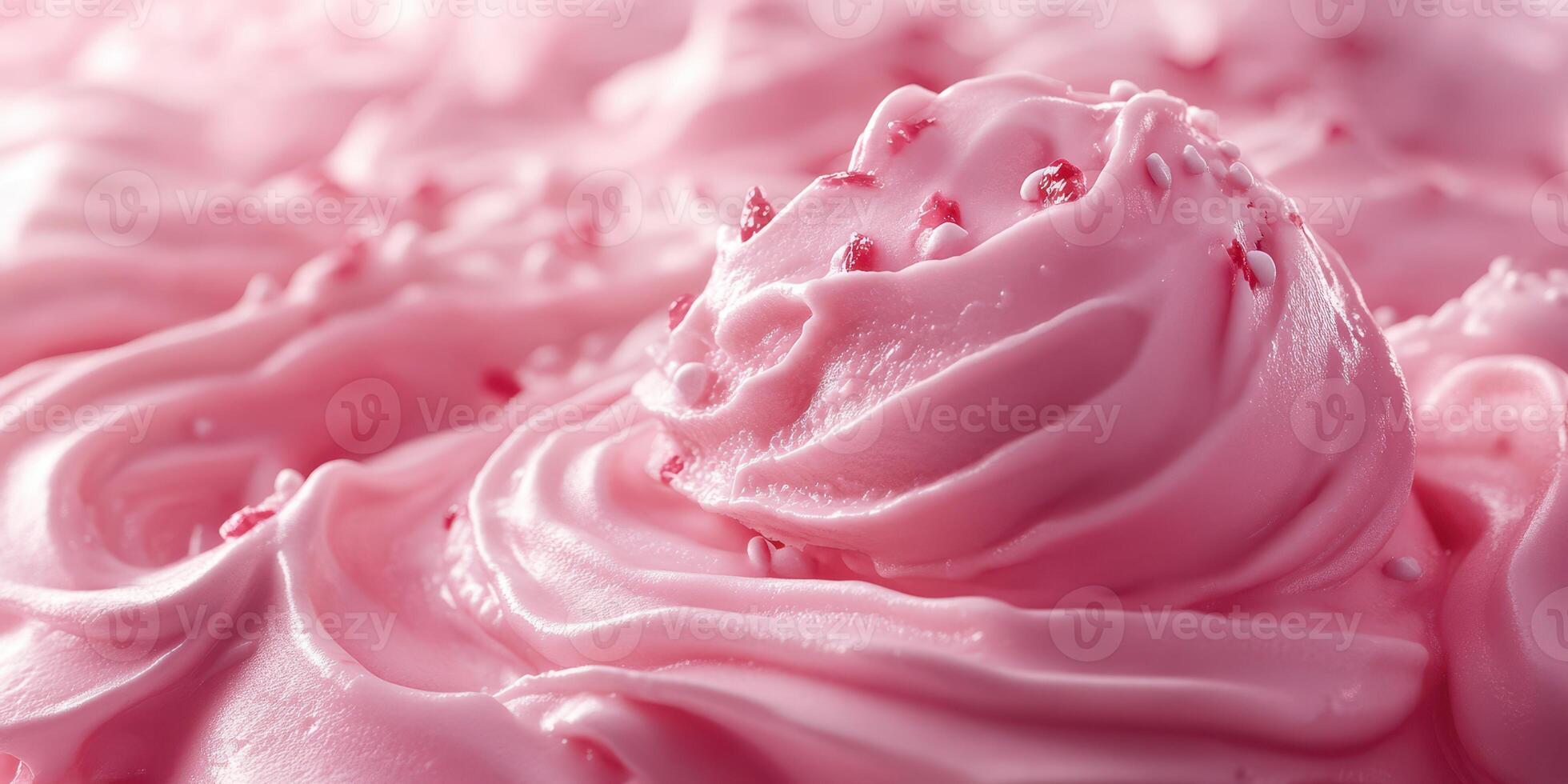 Delicious pink frosting swirled on a dessert with sprinkles and a smooth texture photo