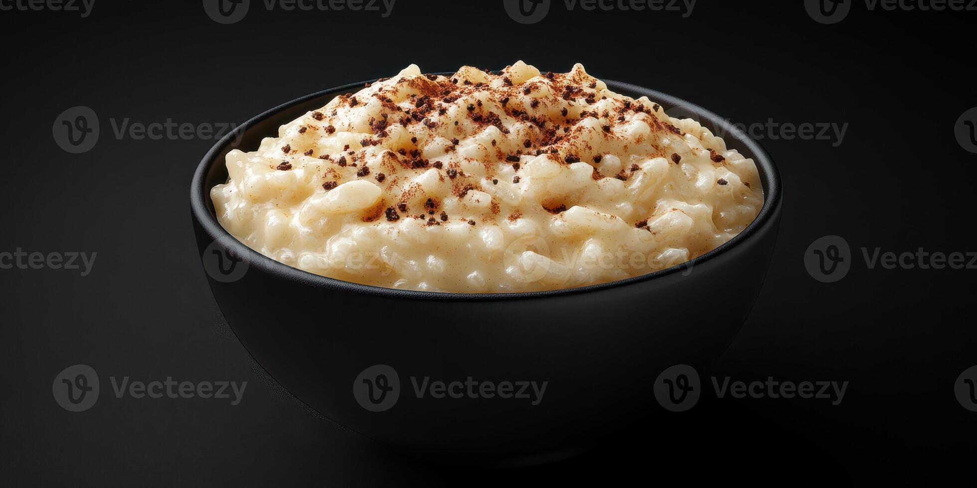 Delicious bowl of creamy rice pudding topped with a sprinkle of cinnamon for a comforting dessert photo