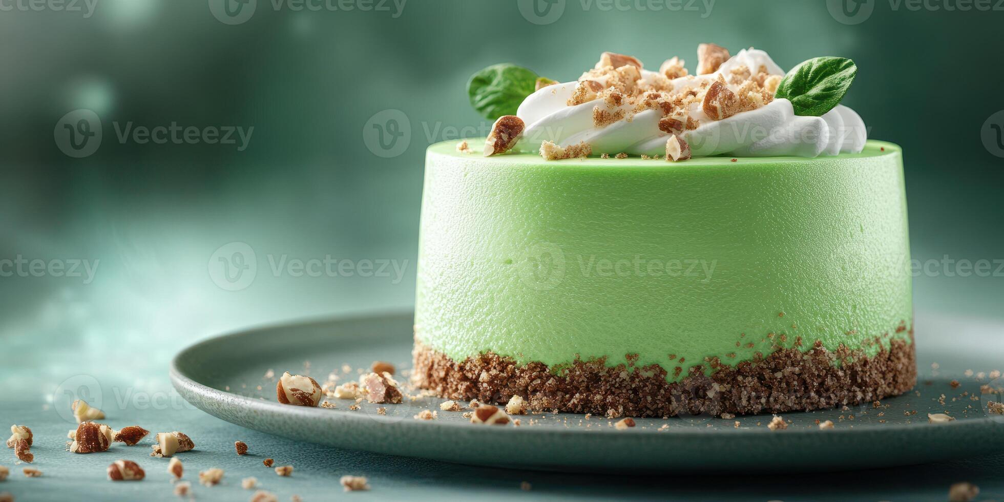 Delightful green dessert garnished with cream and crunchy topping served on a plate photo