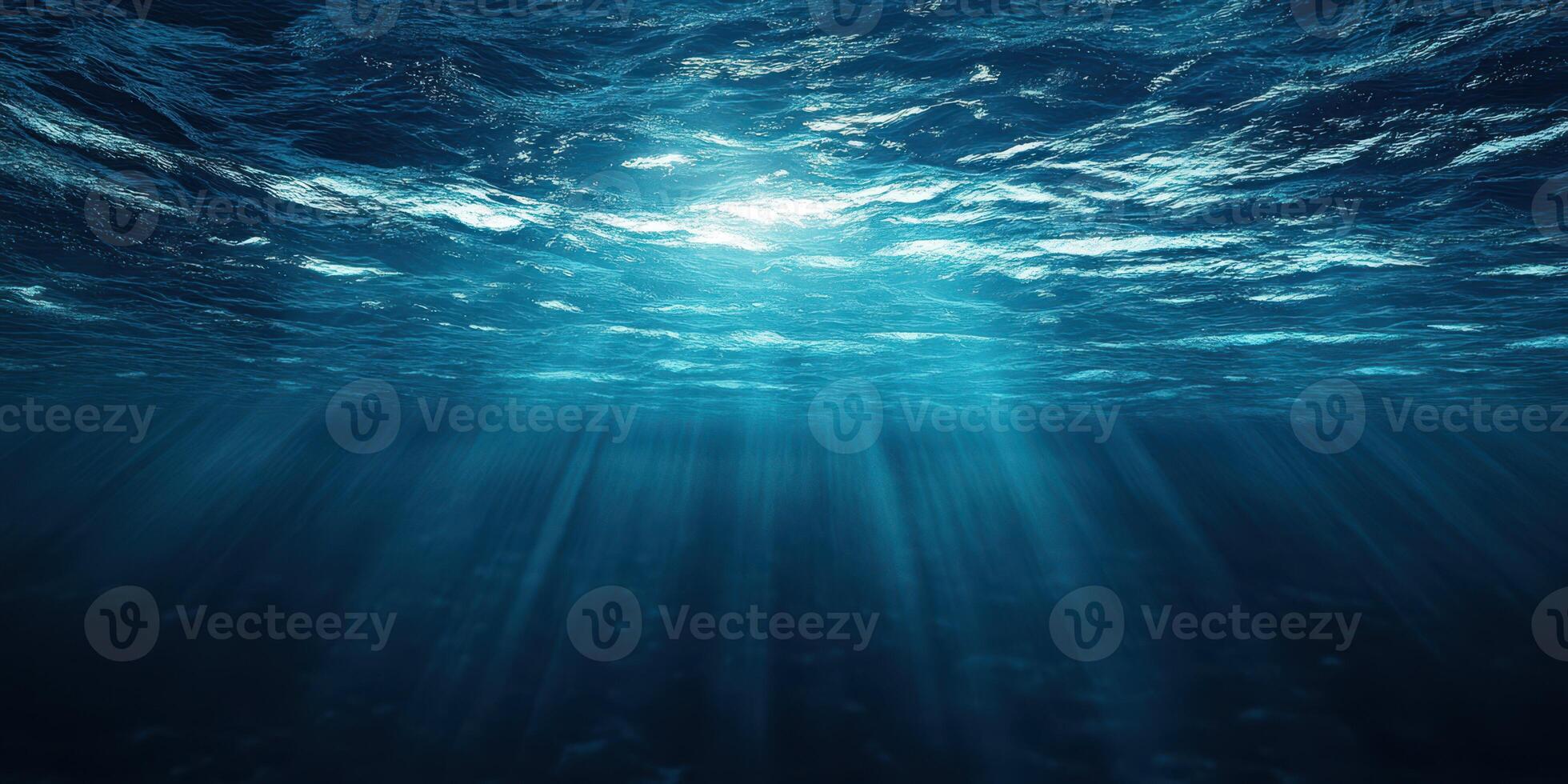 Sunlight filtering through deep ocean waters creating a serene underwater atmosphere in the early morning photo