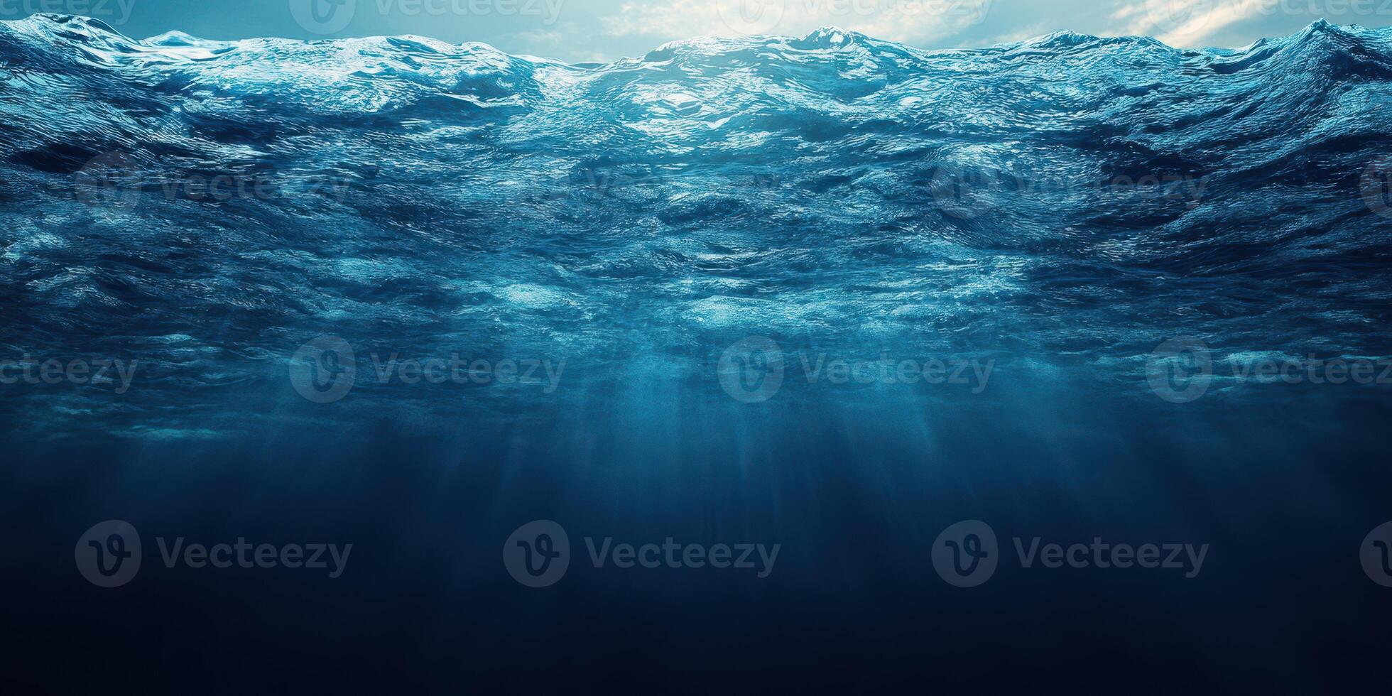 Deep blue ocean water illuminated by sunlight filtering through the surface creating a serene underwater atmosphere photo
