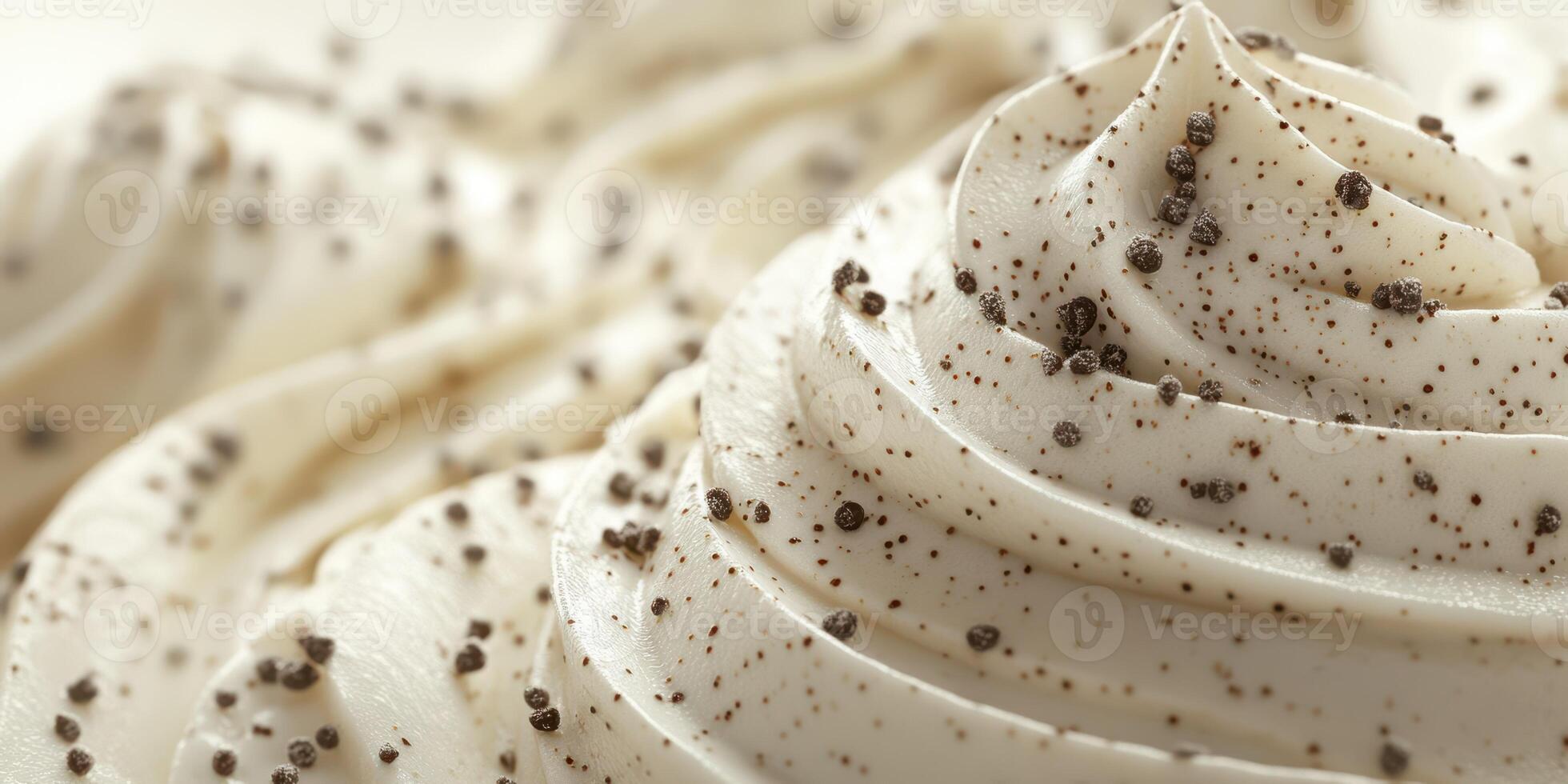 Creamy vanilla frosting topped with specks of black pepper adds a unique twist to desserts photo