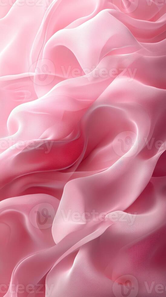 Soft pink silk fabric draping elegantly with delicate waves and flowing textures in a creative display of texture and color photo