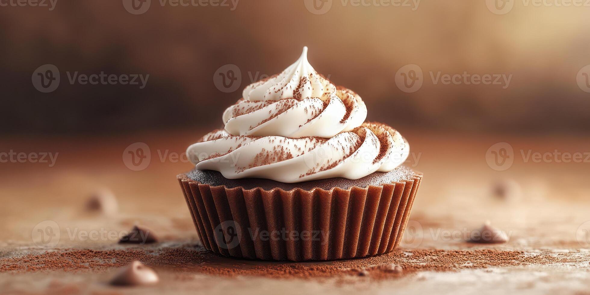 Delicious chocolate cupcake topped with creamy frosting and cocoa powder in warm lighting photo