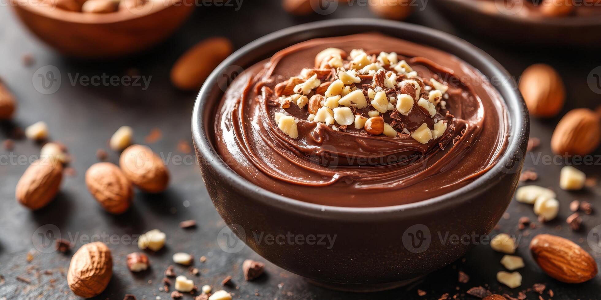 Delicious chocolate dessert with nuts served in a rustic bowl on a dark background photo