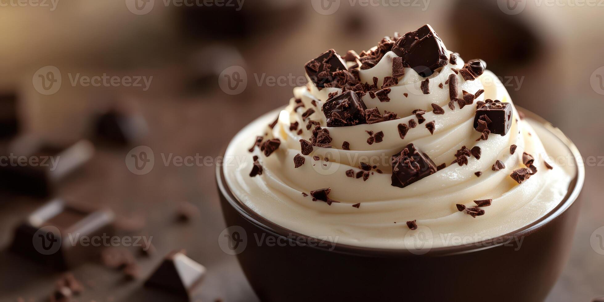 Delicious chocolate mousse with whipped cream and chocolate shavings garnished on top, perfect for dessert enthusiasts photo