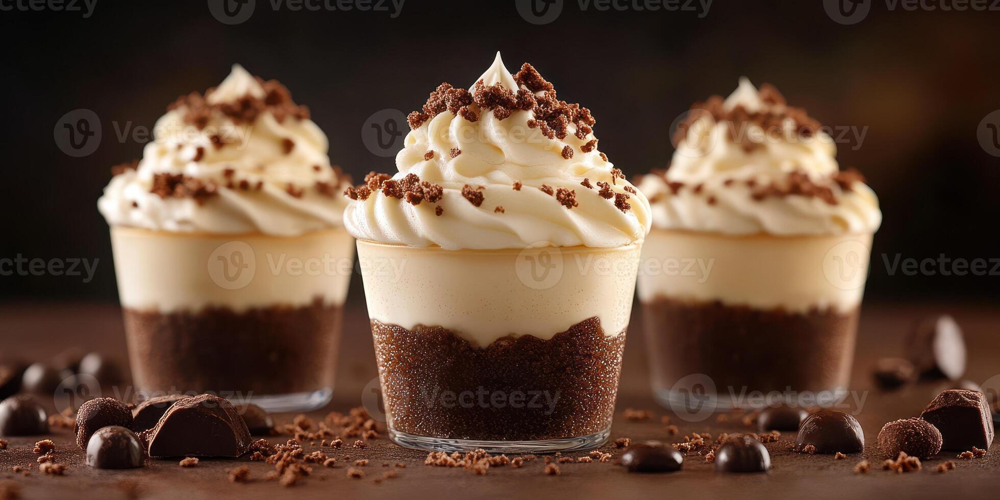 Delightful dessert cups with creamy frosting and chocolate toppings served in an elegant setting photo