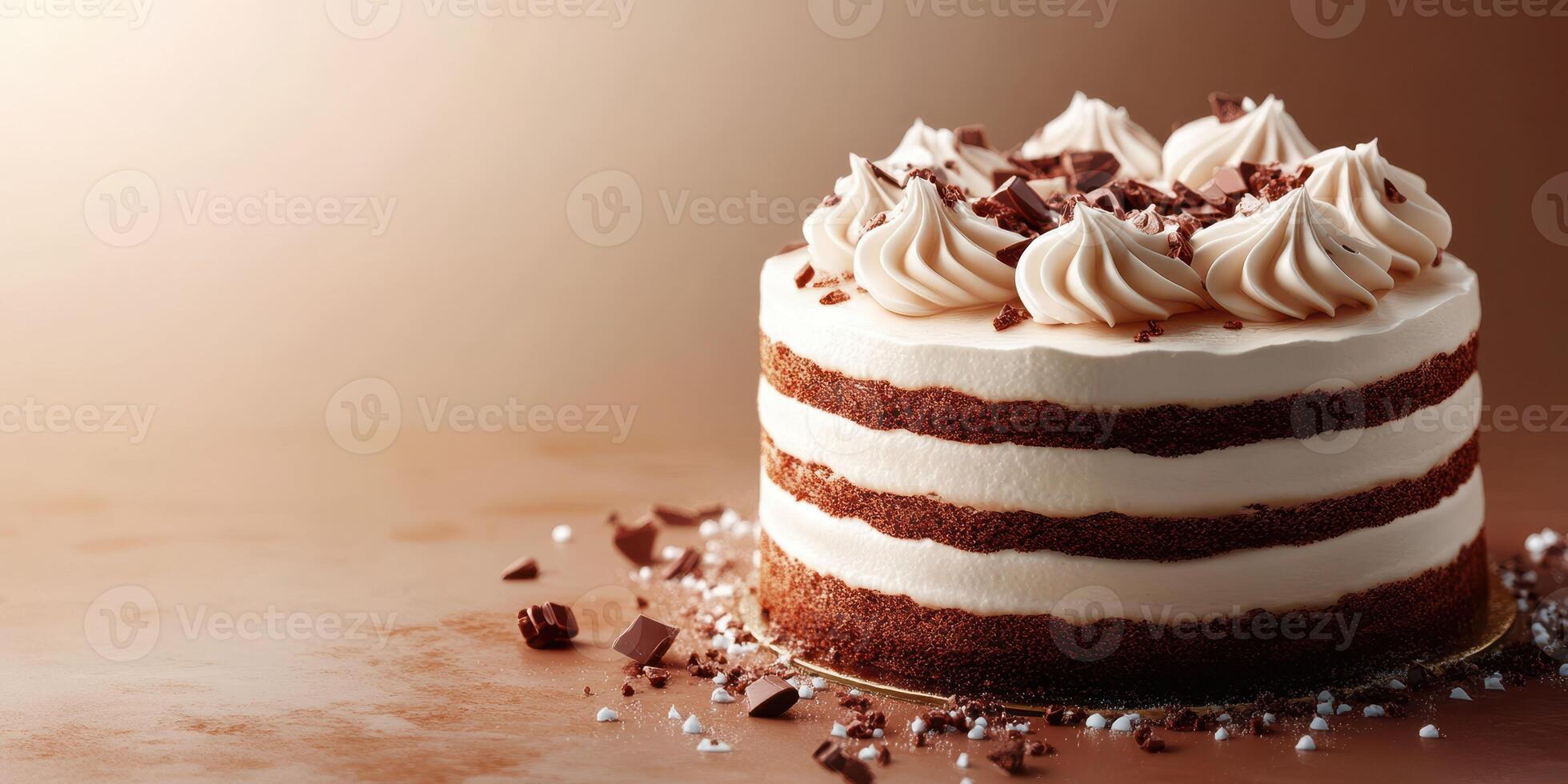 Delicious chocolate cake decorated with cream and chocolate shavings on a smooth surface photo