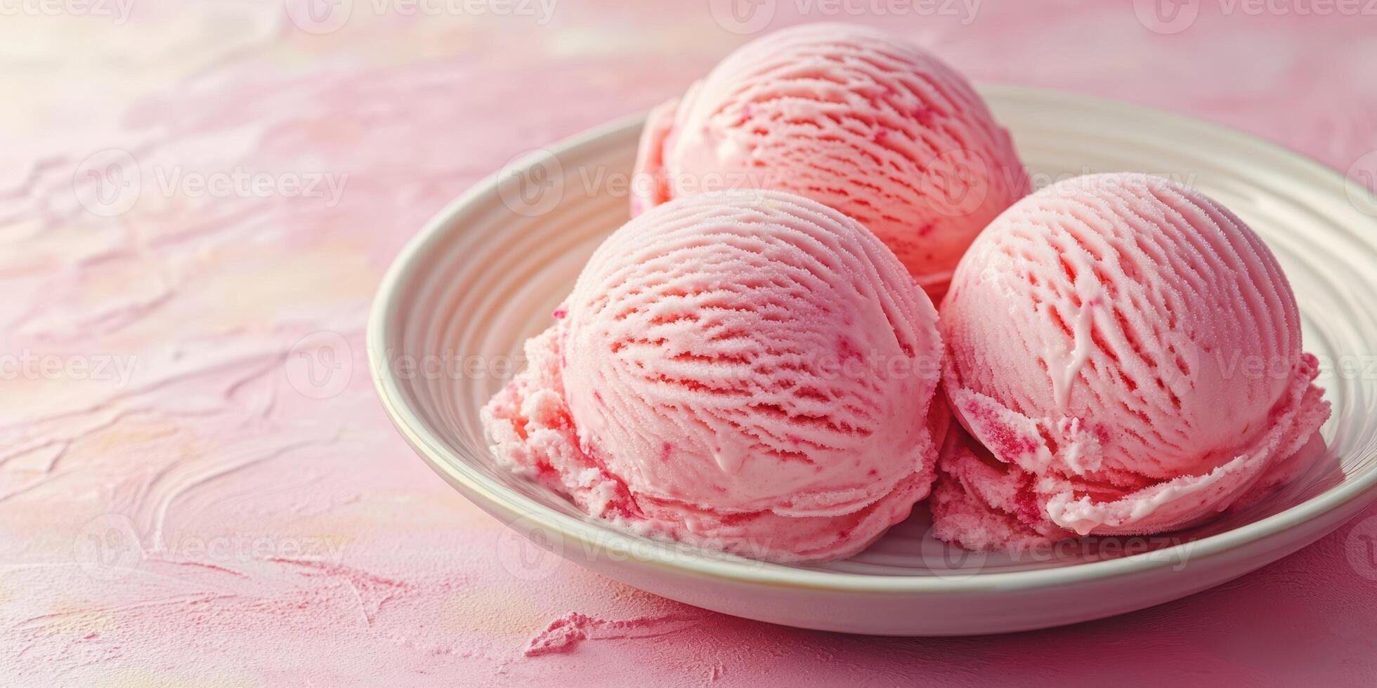 Delightful pink ice cream scoops served on a plate over a pastel background during a summer afternoon photo