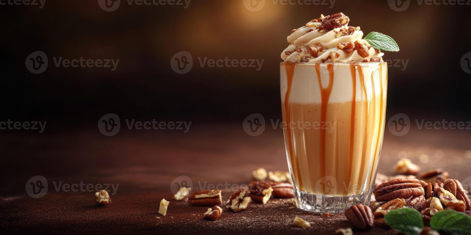 Delicious creamy drink topped with nuts and caramel served in a stylish glass on a dark background photo