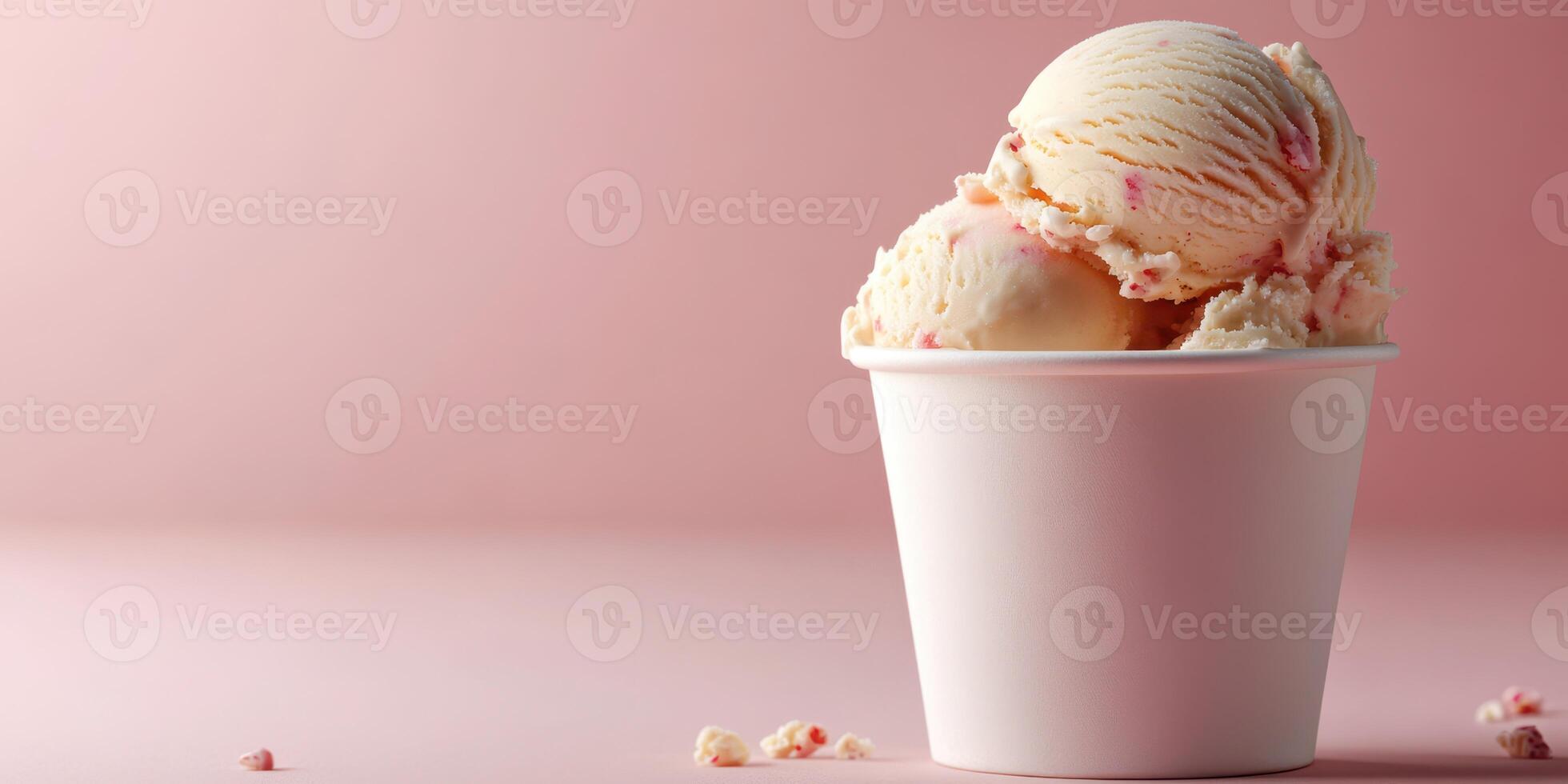 Delicious ice cream served in a white cup with a pink background, perfect for a warm day or celebration photo