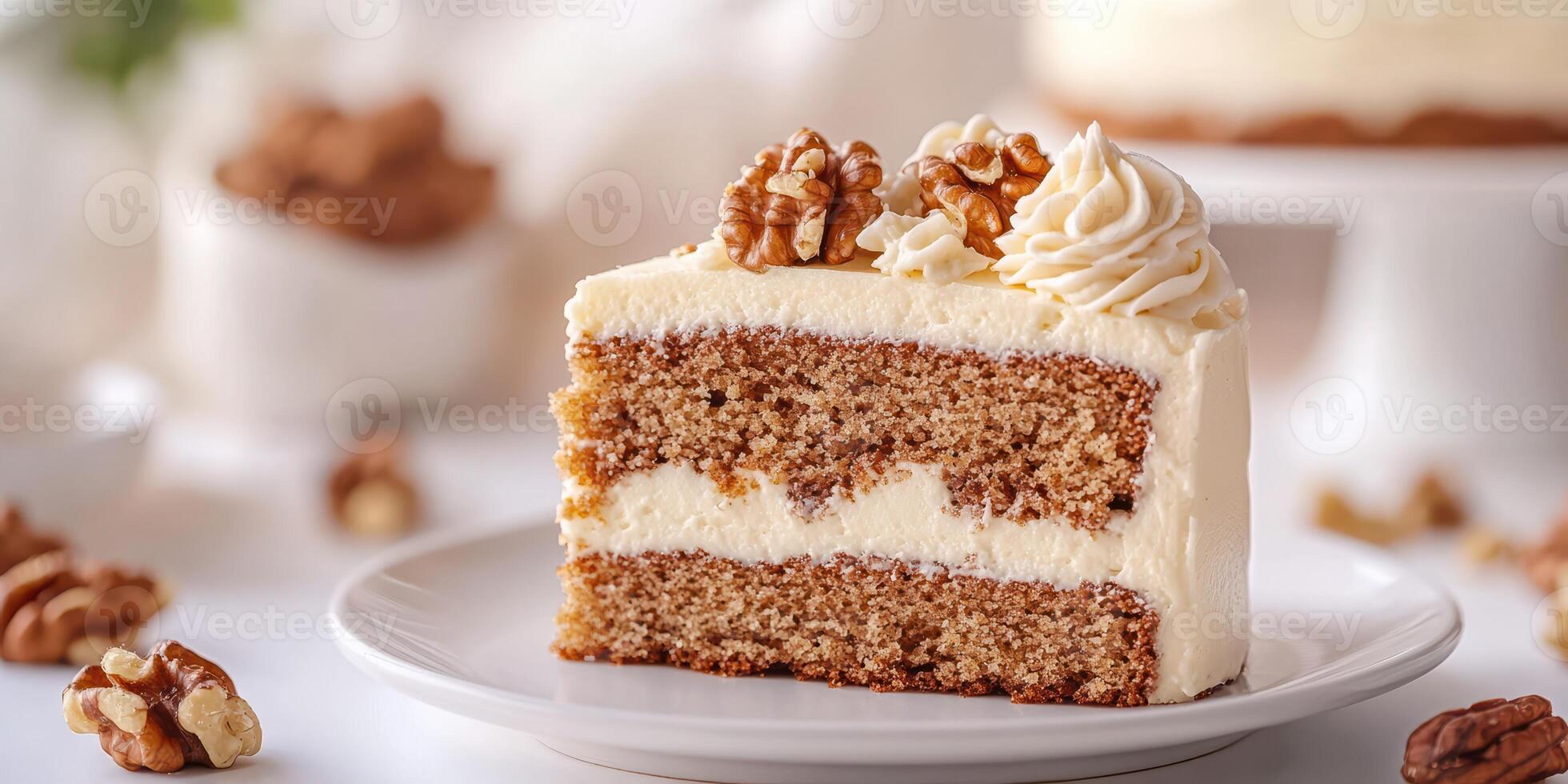 Deliciously moist walnut cake slice topped with creamy frosting and nuts on a white plate photo
