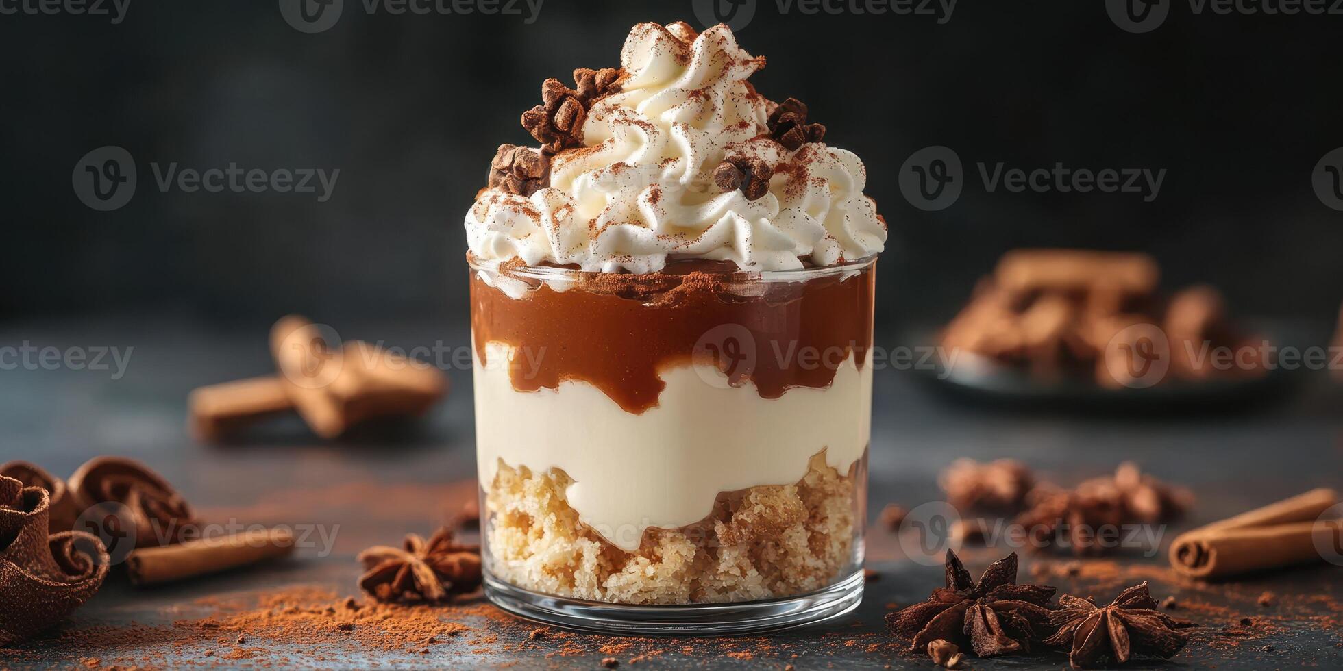 Indulging in a delicious layered dessert with whipped cream and chocolate on a dark background photo