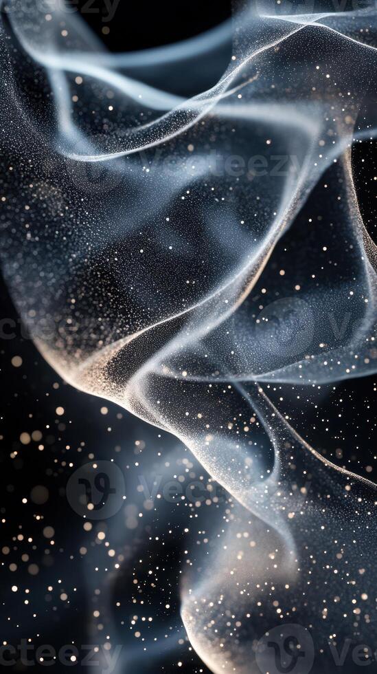 Ethereal wisps of smoke dance gracefully in a dark setting, illuminated by soft light and sparkling particles photo