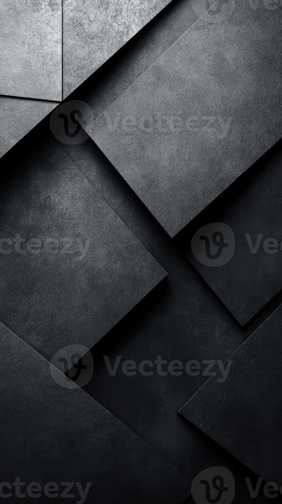 Textured dark surfaces with geometric shapes create a modern, minimalist design in an abstract composition photo