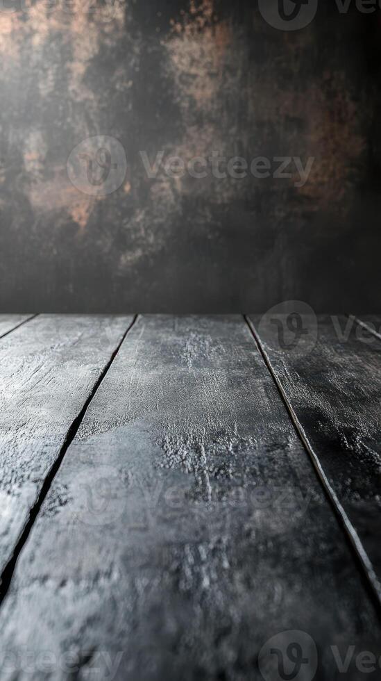 Dark textured wooden surface with soft lighting creating a moody atmosphere for artistic presentations or photography photo