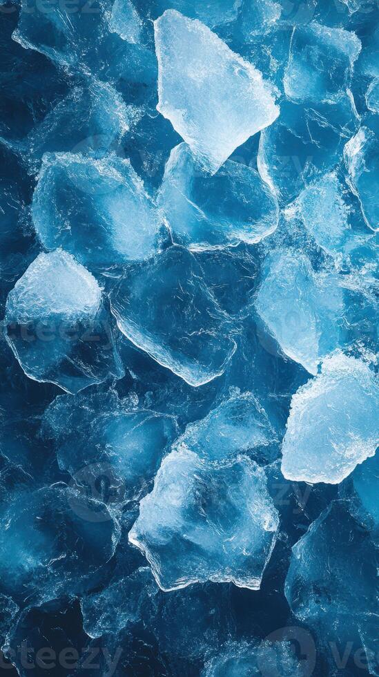 Ice cubes scattered over a blue surface create a refreshing visual of chill and coolness photo