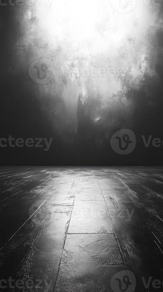 Dark textured floor with illuminated wall reflecting soft light creating an abstract atmosphere in a minimalistic space photo