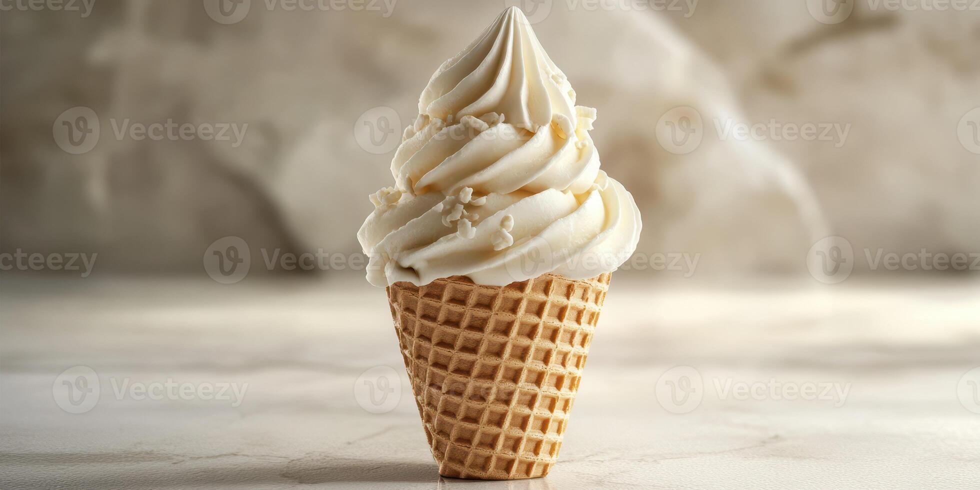 Creamy vanilla soft serve ice cream in a waffle cone on a marble countertop photo